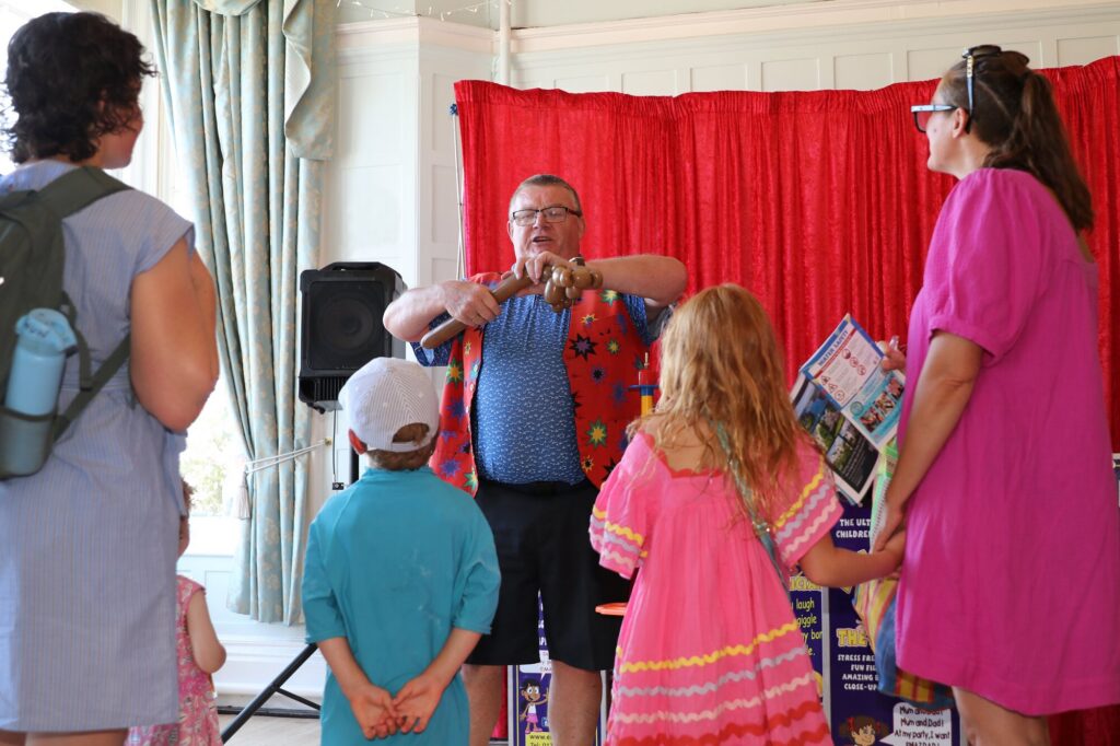 Children watching a balloon entertainer inside Cliff House