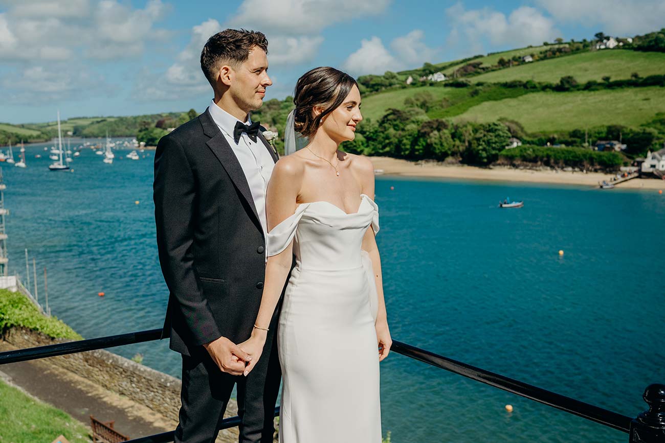 Wedding couple on the terrace overlooking Salcombe Estuary